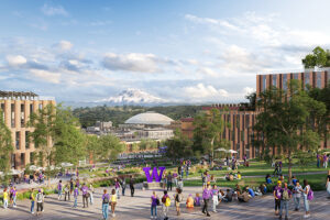 An elevated rendering of a bustling campus plaza filled with students. Modern brick buildings with large windows frame a view of the Tacoma Dome and a snow-capped Mount Rainier in the distance, with a large purple "W" statue in the foreground.